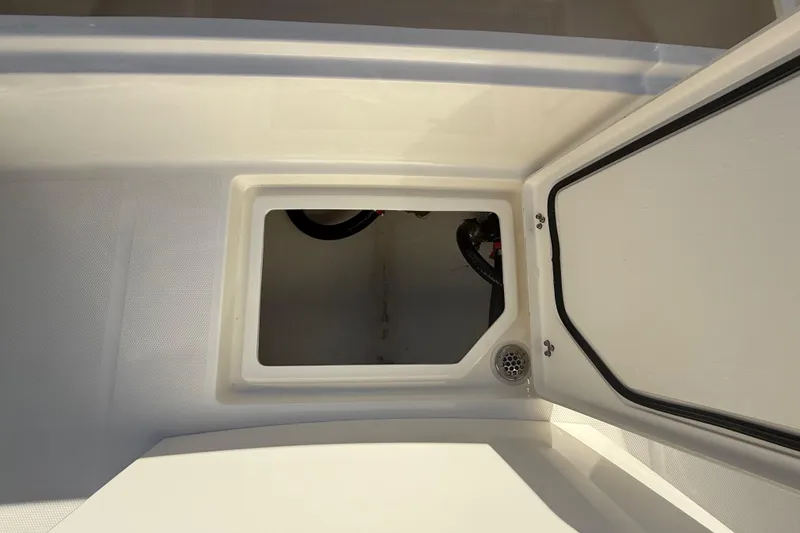 Slide: The Image of Open storage compartment on 2025 Pathfinder 2400 Open boat. - 49