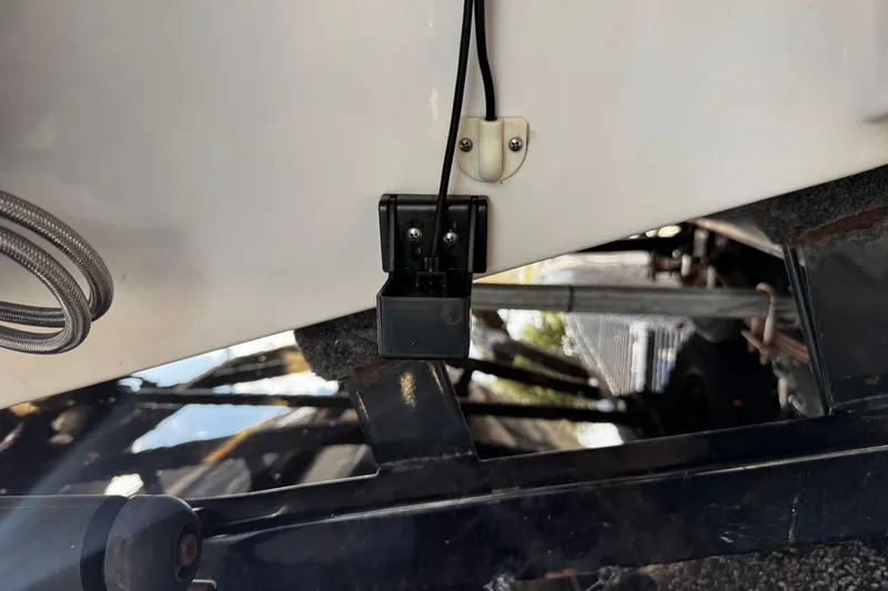 Slide: The Image of 2004 Four Winns 205 Sundowner boat transom with mounted sensor and trailer view. - 22