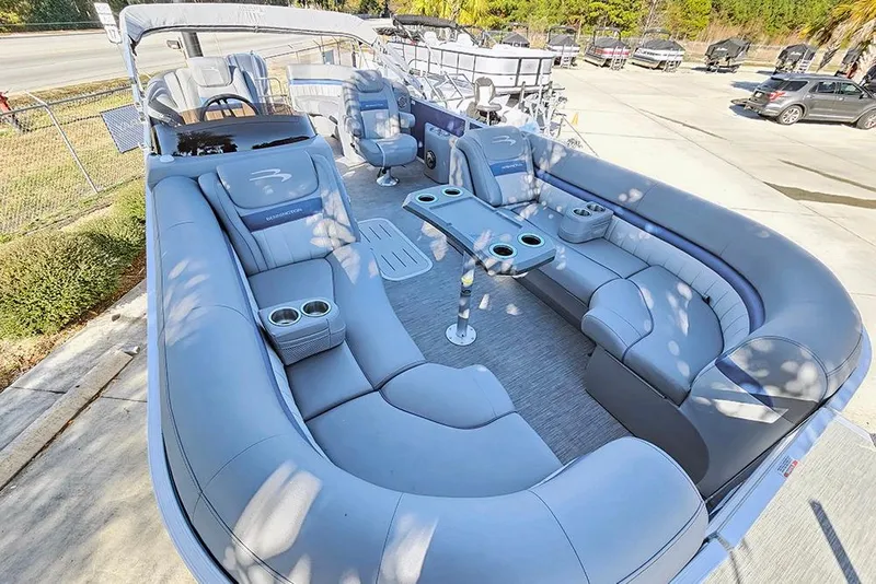 Slide: The Image of 2022 Bennington 24 LXFB pontoon boat with spacious seating and modern design. - 10