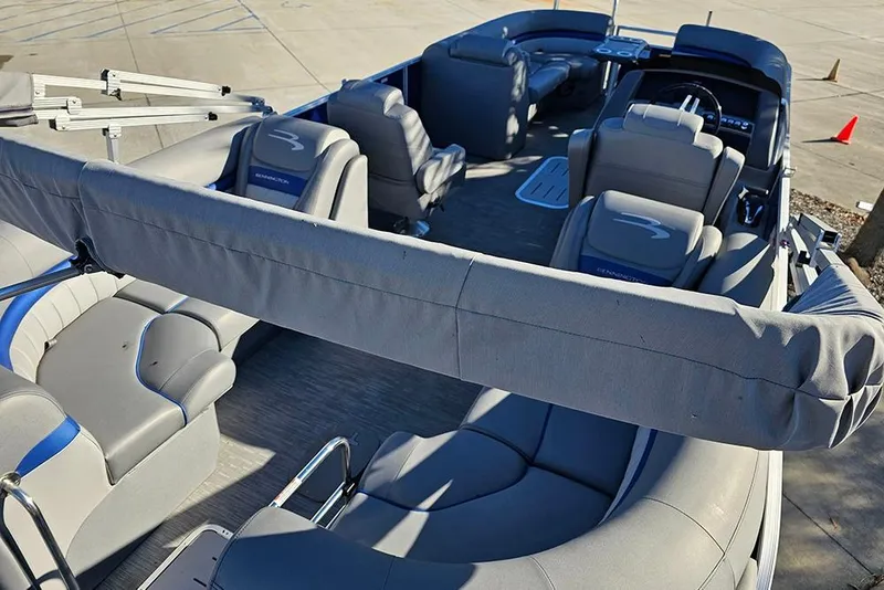 Slide: The Image of 2022 Bennington 24 LXFB pontoon boat interior with plush seating and modern design. - 12