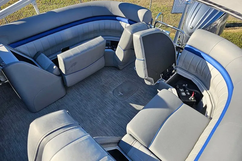 Slide: The Image of 2022 Bennington 24 LXFB pontoon boat interior with gray and blue seating. - 15