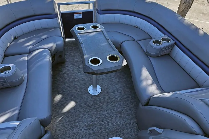 Slide: The Image of Luxurious seating area on 2022 Bennington 24 LXFB pontoon boat with cup holders. - 23