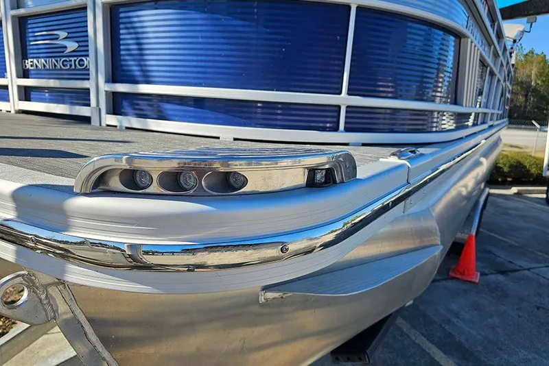Slide: The Image of 2022 Bennington 24 LXFB pontoon boat with sleek design and modern lighting. - 27