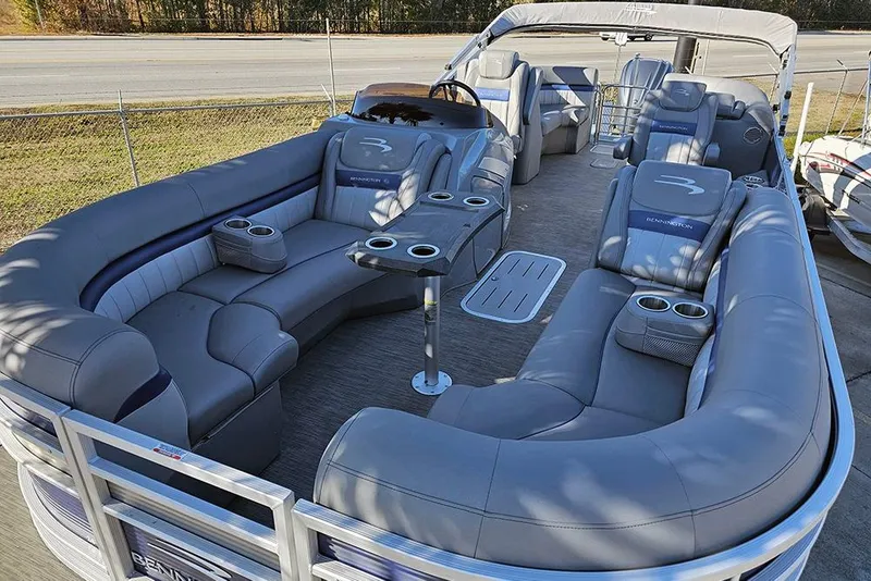 Slide: The Image of 2022 Bennington 24 LXFB pontoon boat with luxurious seating and cup holders. - 9