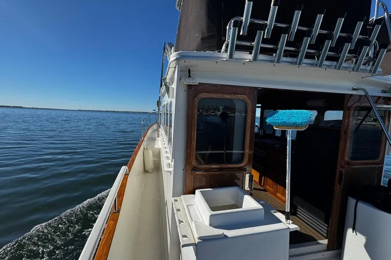 Slide: The Image of 1979 Californian 34 boat cruising on calm waters under clear blue skies. - 21