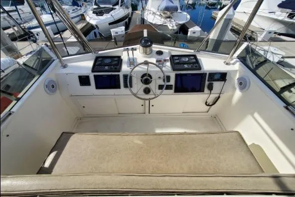 Slide: The Image of Cockpit of 1979 Californian 34 yacht with steering wheel and navigation controls. - 22