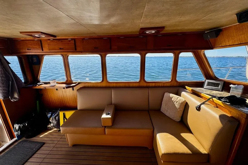 Slide: The Image of Interior of a 1979 Californian 34 yacht with ocean view through large windows. - 26