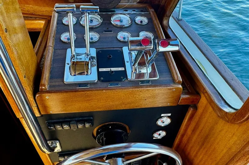 Slide: The Image of Vintage 1979 Californian 34 boat helm with wooden dashboard and chrome controls. - 28