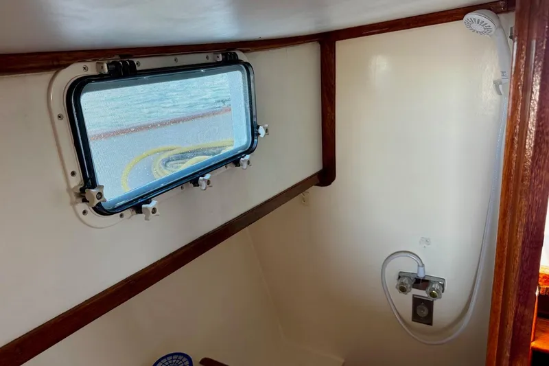 Slide: The Image of Interior of 1979 Californian 34 boat with window and shower fixtures. - 32