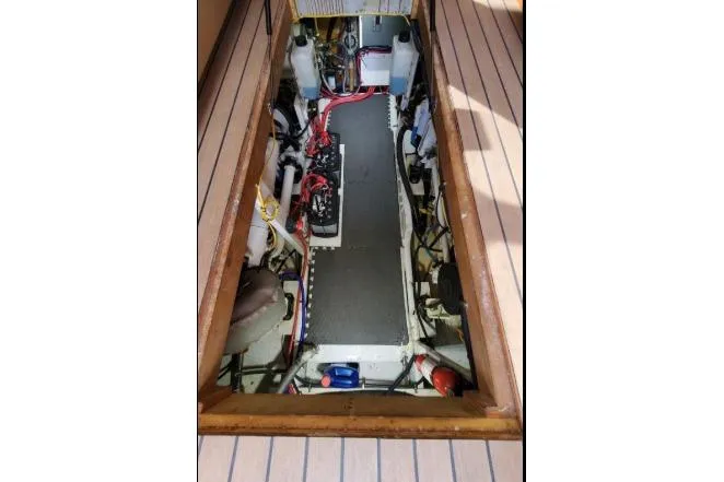 Slide: The Image of Engine compartment of a 1979 Californian 34 boat, showcasing wiring and components. - 40