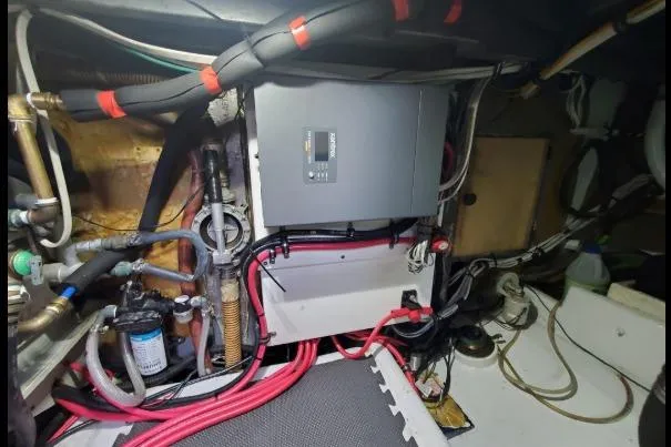 Slide: The Image of Engine room of a 1979 Californian 34 boat with wiring and equipment. - 42