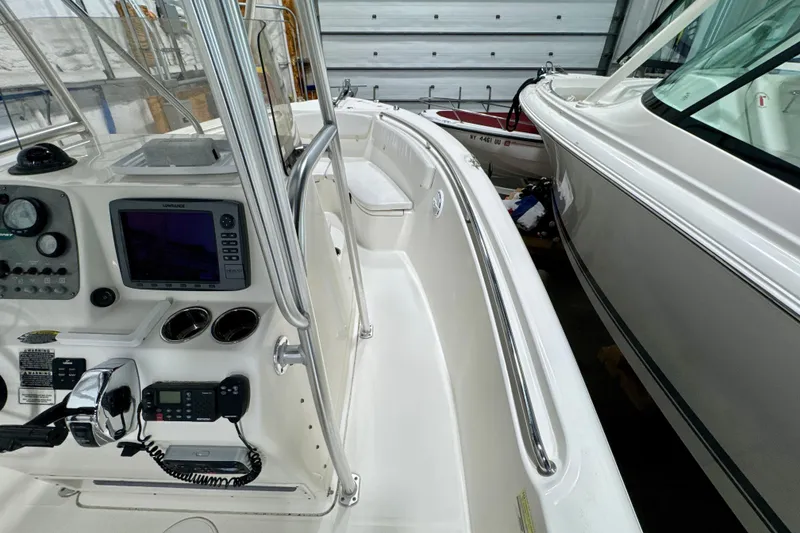 Slide: The Image of 2010 Trophy 2203 Center Console boat interior with navigation equipment and controls. - 11
