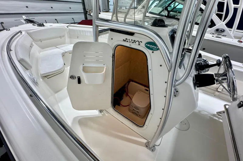 Slide: The Image of 2010 Trophy 2203 Center Console boat interior with open storage compartment. - 16