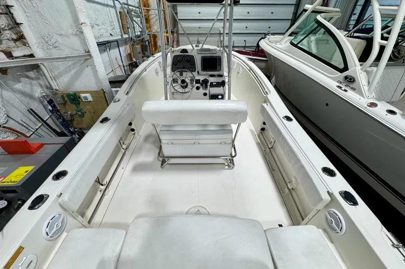 Slide: The Image of 2010 Trophy 2203 Center Console boat interior with steering wheel and seating. - 6