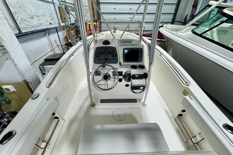Slide: The Image of 2010 Trophy 2203 Center Console boat interior with steering wheel and control panel. - 8