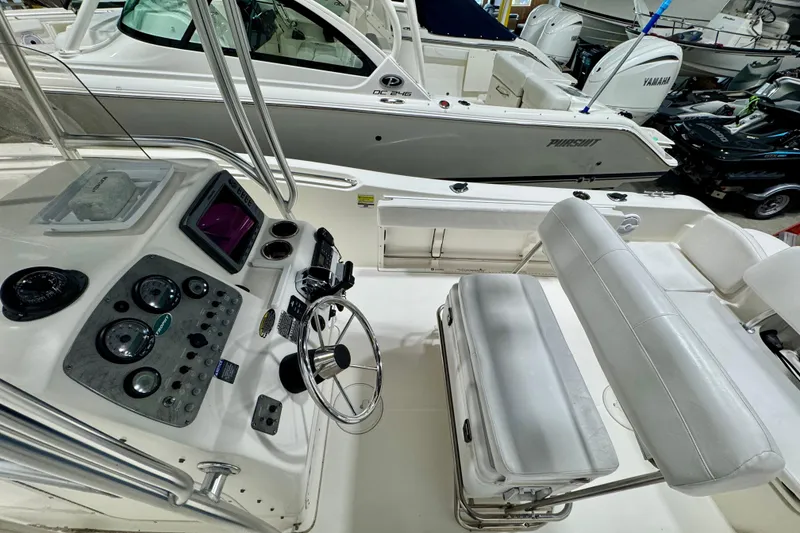 Slide: The Image of 2010 Trophy 2203 Center Console boat interior with steering wheel and control panel. - 9