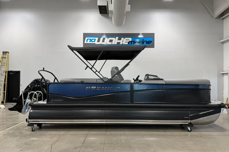 The Image of 2026 Premier 210 Sunsation RF-CL pontoon boat in showroom, featuring sleek design and modern amenities. - 1