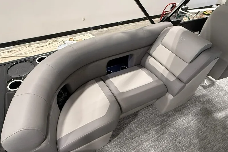 Slide: The Image of Luxurious seating on 2026 Premier 210 Sunsation RF-CL boat, featuring plush gray upholstery. - 11