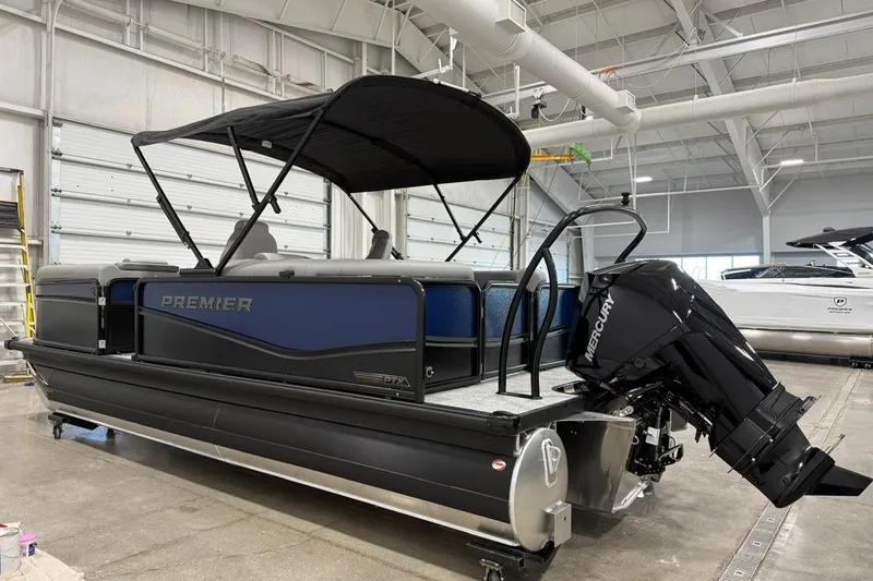 Slide: The Image of 2026 Premier 210 Sunsation RF-CL pontoon boat with Mercury outboard in a showroom. - 3