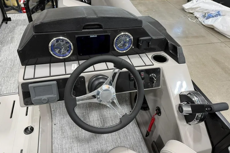 Slide: The Image of 2026 Premier 210 Sunsation RF-CL boat dashboard with steering wheel and controls. - 8