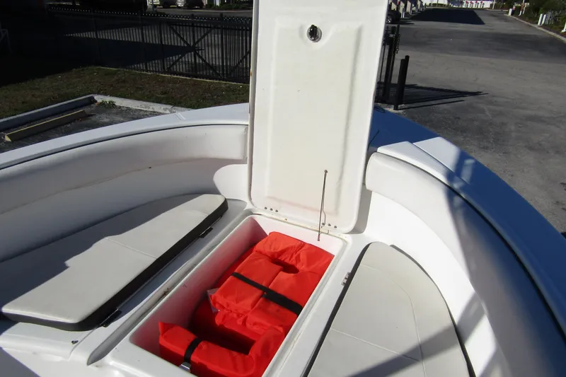 Slide: The Image of 2019 Clearwater Sportfishing Boats 2200 CC with open storage compartment and life jackets. - 12