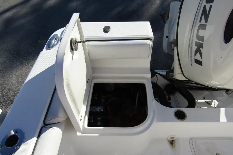 Slide: The Image of 2019 Clearwater Sportfishing Boats 2200 CC with open storage compartment and Suzuki engine. - 24