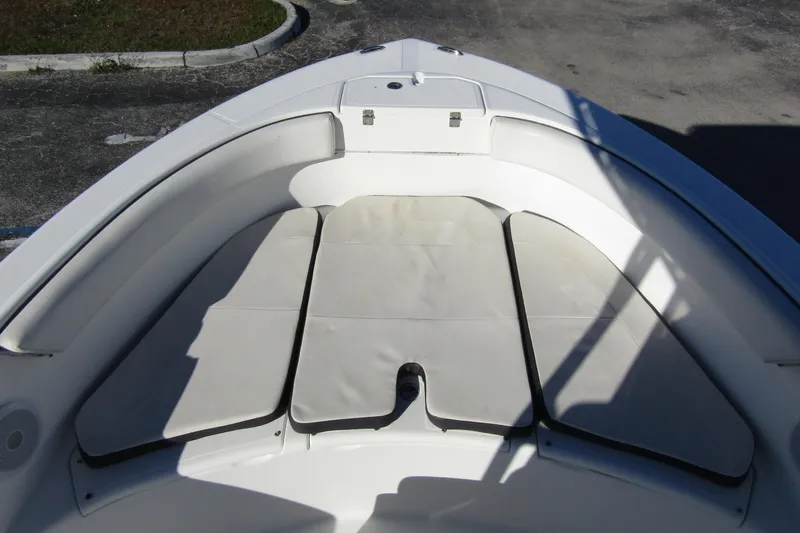Slide: The Image of 2019 Clearwater Sportfishing Boats 2200 CC bow seating area with cushioned layout. - 10