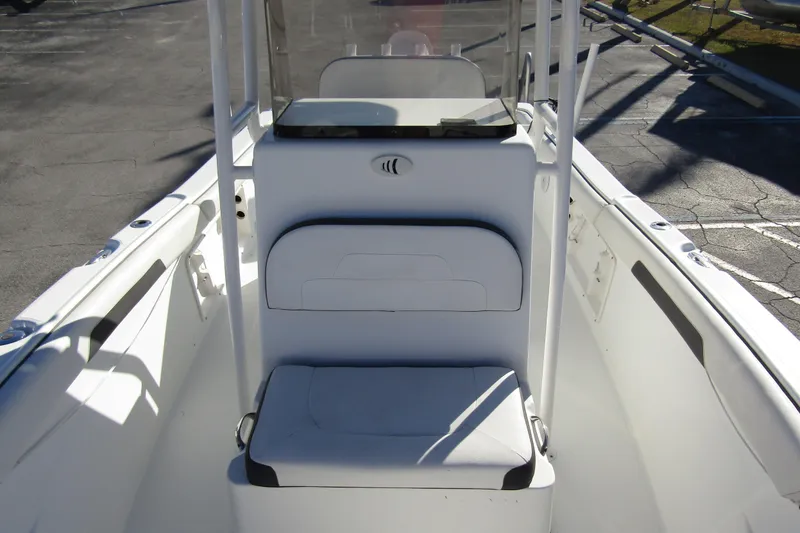 Slide: The Image of 2019 Clearwater Sportfishing Boats 2200 CC interior with seating and console. - 13