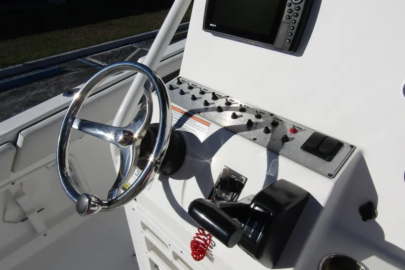 Slide: The Image of Steering console of 2019 Clearwater Sportfishing Boats 2200 CC with controls and display. - 20