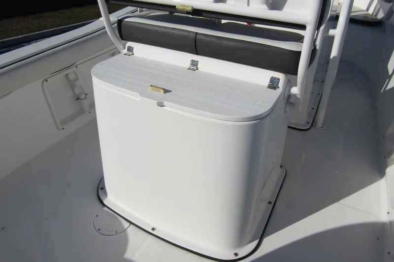Slide: The Image of 2019 Clearwater Sportfishing Boats 2200 CC center console seating and storage area. - 25
