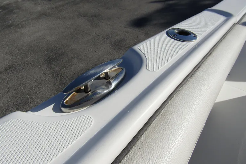Slide: The Image of 2019 Clearwater Sportfishing Boats 2200 CC, close-up of deck cleat and rod holder. - 31