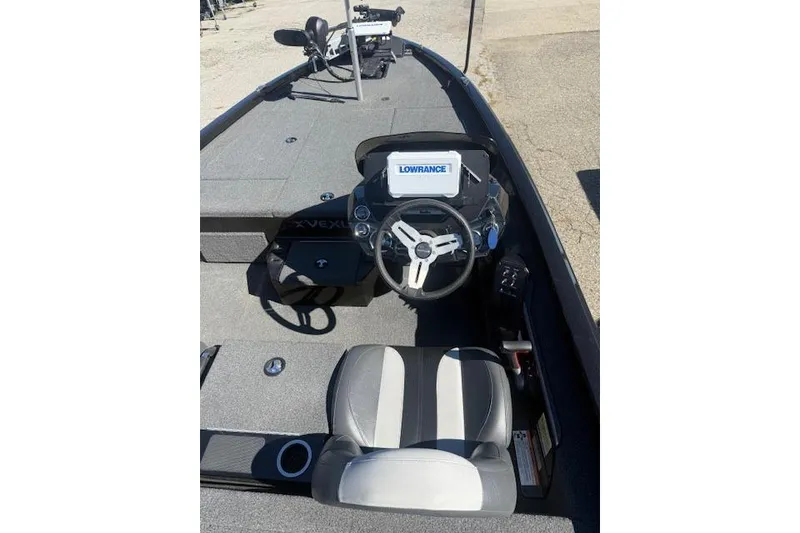 Slide: The Image of 2023 Vexus AVX1880 boat interior with Lowrance navigation system and steering wheel. - 3