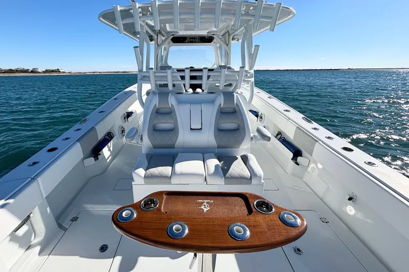 Slide: The Image of 2024 Freeman 38 boat interior with luxurious seating and ocean view. - 15