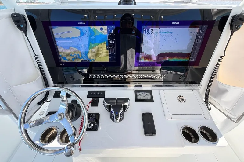 Slide: The Image of Control panel of a 2024 Freeman 38 boat with dual Simrad displays. - 16