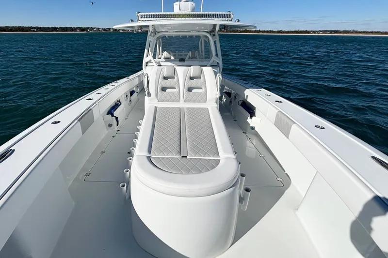 Slide: The Image of 2024 Freeman 38 boat with sleek design on open water. - 17