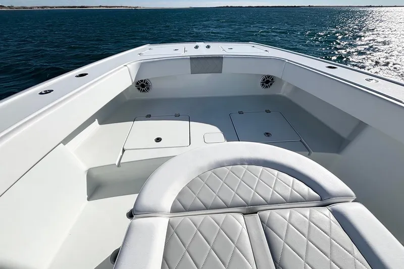 Slide: The Image of 2024 Freeman 38 boat interior with quilted seating, spacious deck, and ocean view. - 20