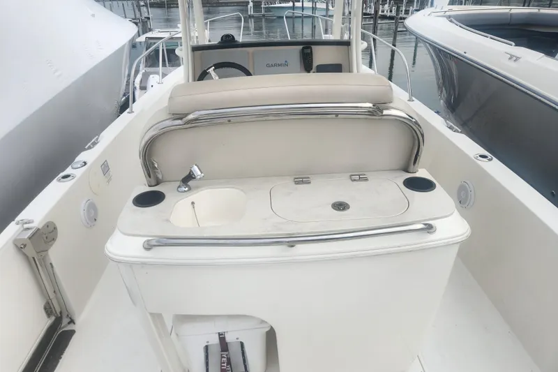 Slide: The Image of 2018 Boston Whaler 270 Dauntless boat interior with sink and seating area. - 6