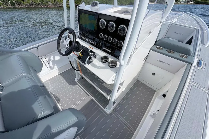 Slide: The Image of 2023 Concept 30' Cuddy Cabin boat interior with modern dashboard and seating. - 13