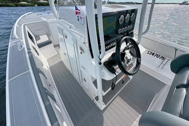 Slide: The Image of 2023 Concept 30' Cuddy Cabin boat interior with modern dashboard and steering wheel. - 14