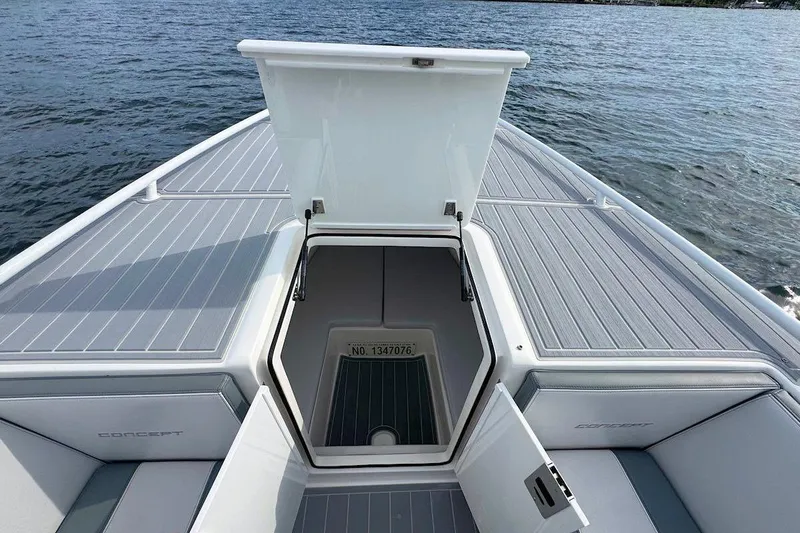 Slide: The Image of 2023 Concept 30' Cuddy Cabin boat with open hatch on calm water. - 19