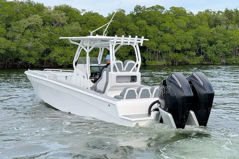 Slide: The Image of 2023 Concept 30' Cuddy Cabin boat cruising on water with twin engines. - 4