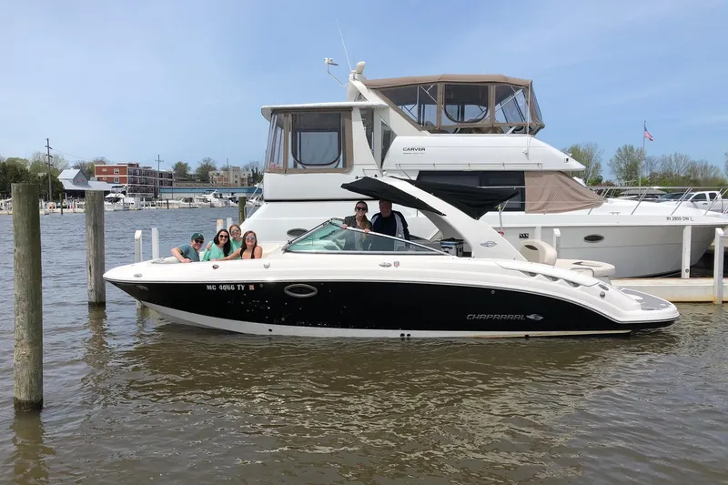 The Image of 2016 Chaparral 287 SSX boat with passengers docked at a marina. - 0