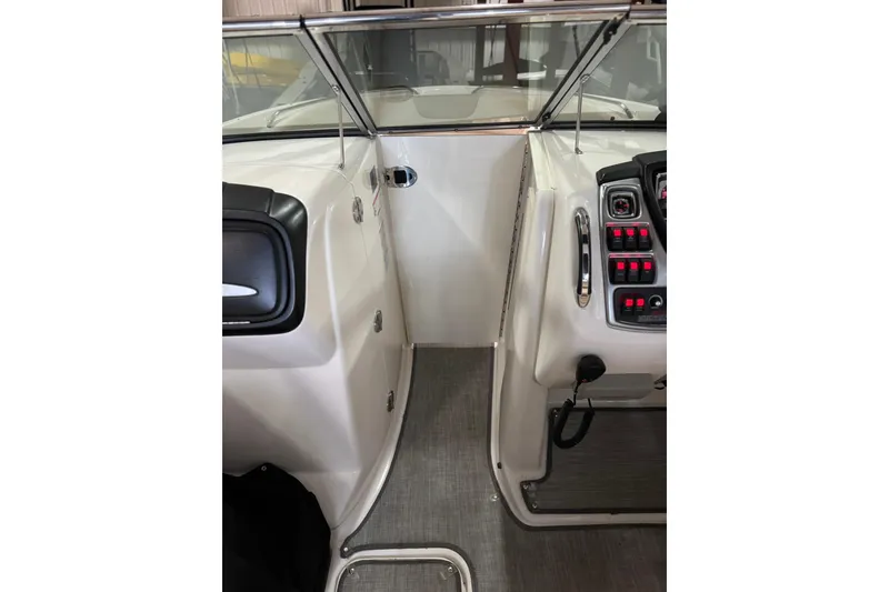 Slide: The Image of Interior view of 2016 Chaparral 287 SSX boat cockpit with control panel and seating. - 15