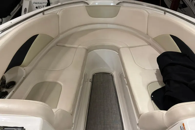 Slide: The Image of 2016 Chaparral 287 SSX boat interior with beige seating and sleek design. - 18