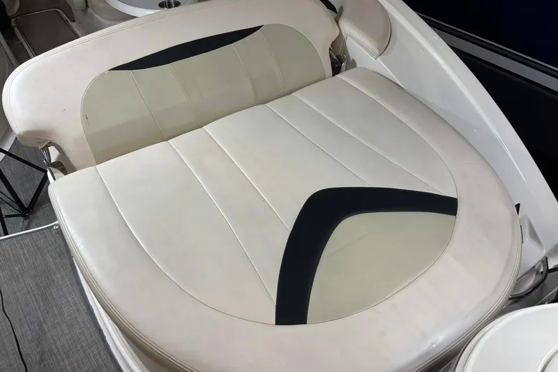 Slide: The Image of 2016 Chaparral 287 SSX boat seating with white and black upholstery. - 26