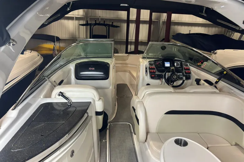 Slide: The Image of Interior of a 2016 Chaparral 287 SSX boat with modern dashboard and seating. - 27