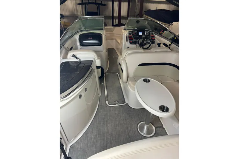 Slide: The Image of Interior of a 2016 Chaparral 287 SSX boat with seating and control panel. - 28