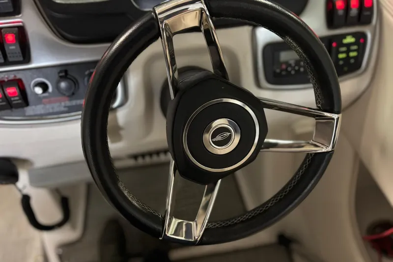 Slide: The Image of Steering wheel of a 2016 Chaparral 287 SSX boat with control panel. - 3