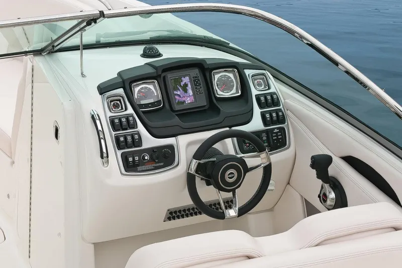 Slide: The Image of Manufacturer Provided Image: 2016 Chaparral 287 SSX boat dashboard with steering wheel and control panel. - 36