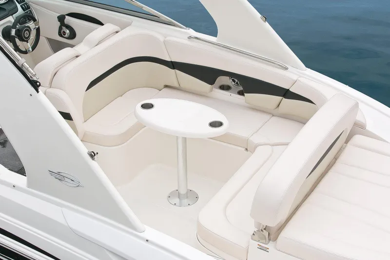 Slide: The Image of Manufacturer Provided Image: 2016 Chaparral 287 SSX boat interior with white seating and table. - 40